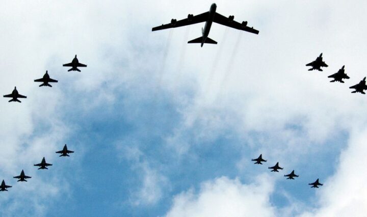 eco-friendly private jets flying over green forest
